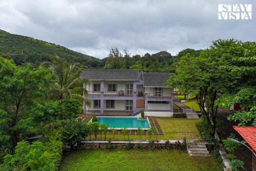 Nashik Villa | StayVista at Whispers of Green with Lawn and Pool