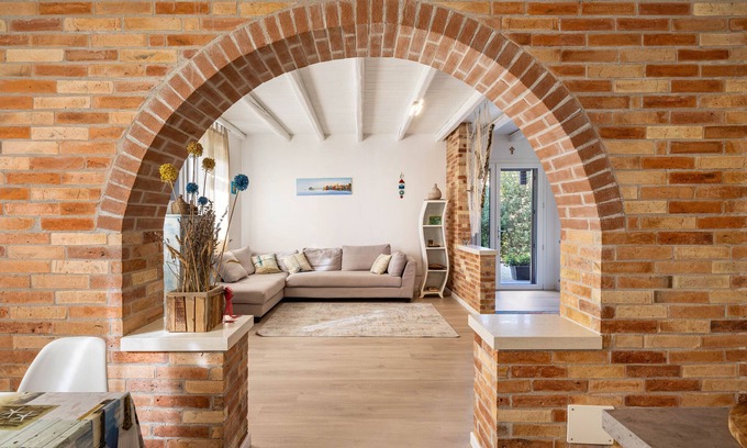 Castello di Brussa Apartment | Studio Apartment 'Appartamento Brussa Beach' with Private Terrace, Wi-Fi and Air Conditioning