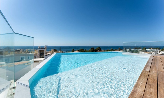 Olhos D'Agua Apartment | Stunning 3 BDR Flat W/Rooftop Pool by LovelyStay