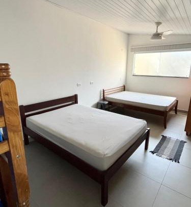 Jardim Carolina House | Suíte com ar condicionado e Wi-Fi