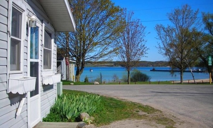 Suttons Bay Cottage | Suttons Bay, in town and steps away from beach - trail, wineries and shopping