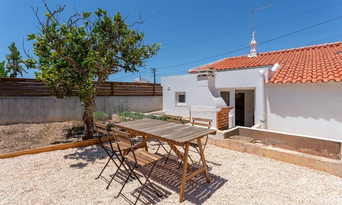 Espiche House | Sweet 2 BDR House With Patio by LovelyStay