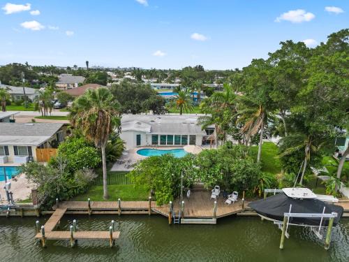 Venetian Way House | The Cocoa Plum - A Quiet Riverfront Pool Home Near Beach