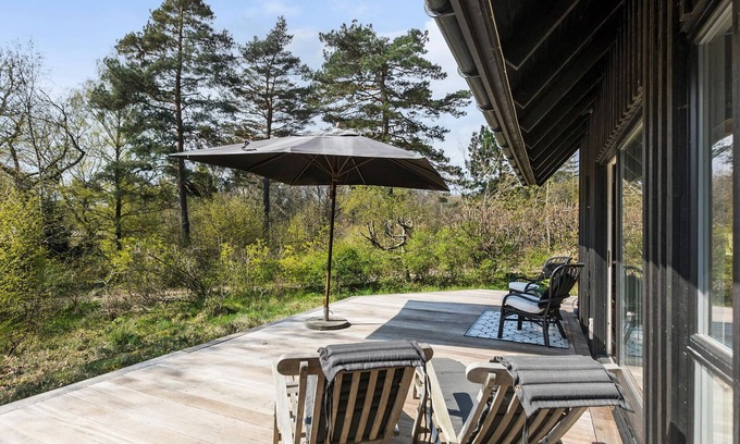 Tisvildeleje House | This attractive wooden house welcomes you in a wooded residential area of Tisvildeleje.