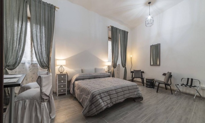 Salario Apartment | This spacious 180sqm apartment with four bedrooms is able to accommodate up to 8 people. Located on the first floor (with elevator) of a restored period building, the apartment overlooks the private park of Villa Albani, one of the most beautiful and pea