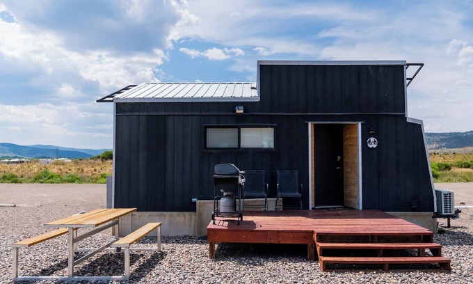 Meeker House | This Tiny Home is custom made by a Colorado craftsman has one Queen bed in loft accessible by stairs and also has a fold out Full futon on main level. Sleeps up to 4. Please note, this home does have a sleeping area in a loft. If you require an accom