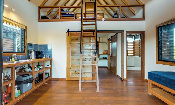 Surfside House | Treehouse cabana in a quiet area with veranda, WiFi & partial AC - walk to beach
