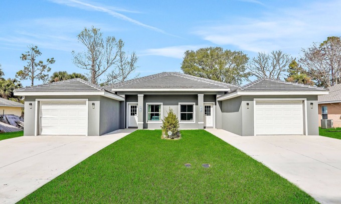 Palm Coast House | Twin villas with private pools, furnished lanais, & all-new interiors