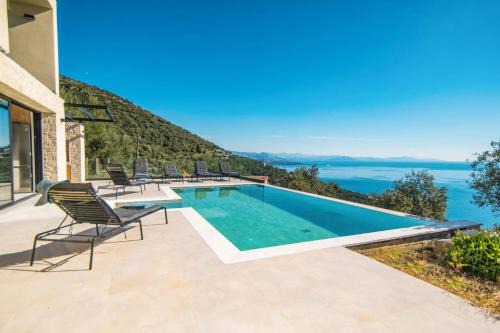 Petaleia Villa | Villa Nissaki View 1 by Villa Plus