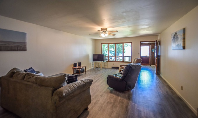 Onekama House | Waterfront home on Portage Lake with lake-view deck & firepit