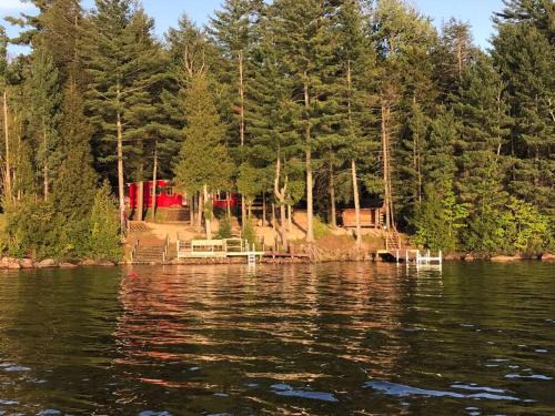 Lyon Mountain House | Well-appointed Adirondack cabin directly on 9-mile lake