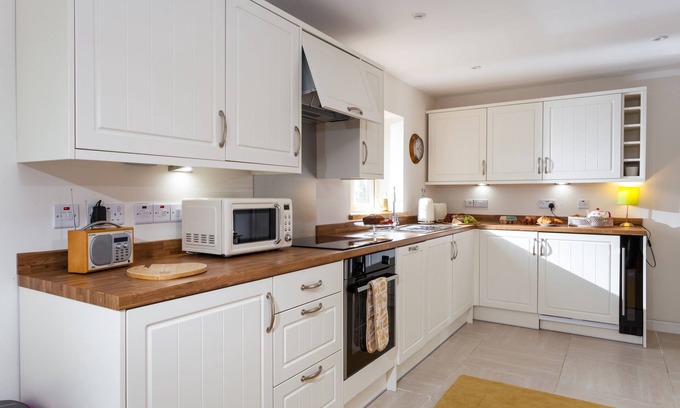 Sibford Gower Cottage | With cosy home comforts in every corner, The Sunset Retreat is the perfect romantic retreat