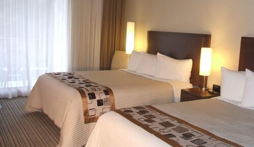 Classic Room, 2 Queen Beds, Single Whirlpool Tub, Balcony