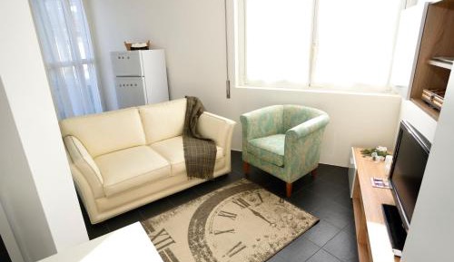 One-Bedroom Apartment with Balcony and City View