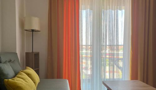 One-Bedroom Apartment with Balcony and City View