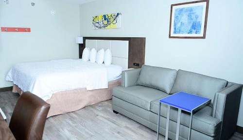 Deluxe King Room with Sofa Bed and Walk-In Shower - Communication Assistance