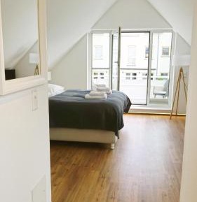 One-Bedroom Apartment with Balcony and City View