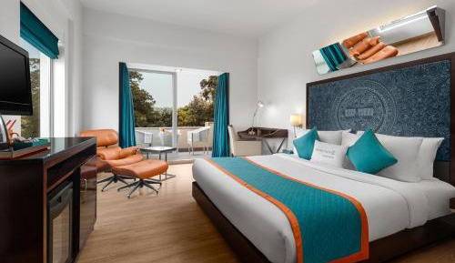 Premium Room with Balcony & Enjoy Happy Hours with 1+1 offer on Alcoholic Beverages, 15% Off on Laundry service, Complimentary In-Room Refreshments featuring Cookie Platter