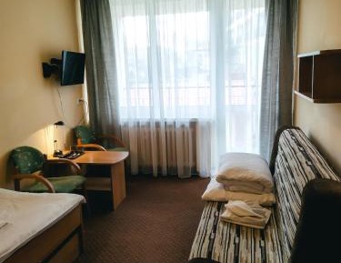Twin Room ( single bed+ sofa)