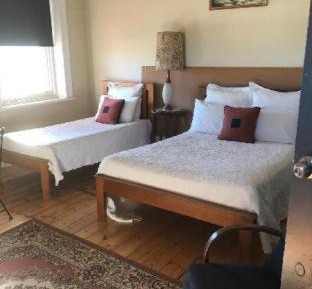 Budget Double Room + Single with Shared Bathroom