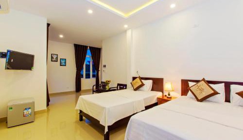 Deluxe Triple Room with Balcony and Garden View