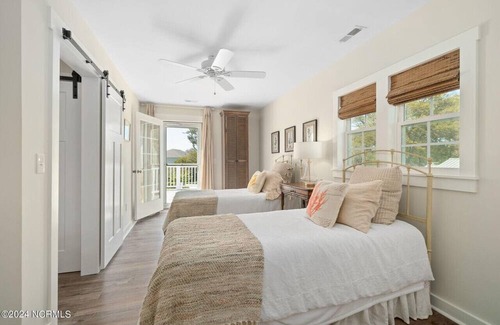 Cedar Point House | Luxury at the Water, enjoy the bikes, kayaks, volleyball, and shared dock that is a short walk away.