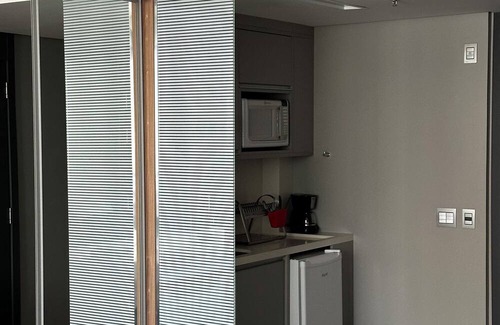 Agua Verde Apartment | Complete studio in Batel, Wi-Fi, kitchen and dining/work table