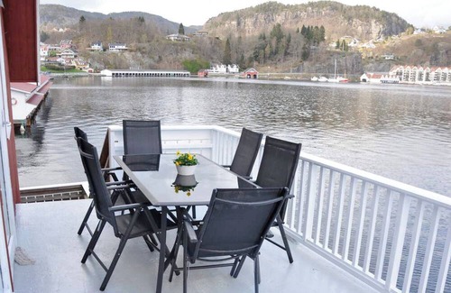 Flekkefjord Apartment | Holiday apartment "Fagerstrand 1", in Flekkefjord, southern Norway, in a beautiful location directly on the water, 4-6 persons, open living-dining area, 2 bedrooms, 1 loft with double mattress, 1 bathroom, Internet, own small veranda with access t...