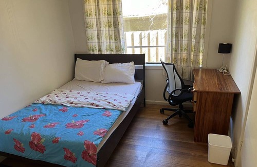Frankston House | One master bedroom with own bathroom, the other one a bedroom with shared bath.