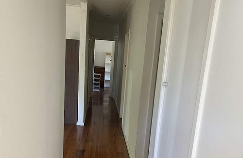Frankston House | One master bedroom with own bathroom, the other one a bedroom with shared bath.