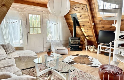 Division No. 10 Cabin | Techni Cabin offers a cozy A-frame blending rustic charm with modern comforts.
