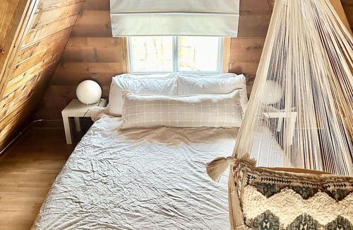 Division No. 10 Cabin | Techni Cabin offers a cozy A-frame blending rustic charm with modern comforts.