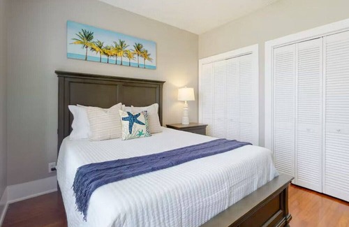 Galveston Cabin | Centrally located unit with shared courtyard, designated hot tub, & fire pit!