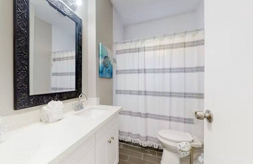 Galveston Cabin | Centrally located unit with shared courtyard, designated hot tub, & fire pit!