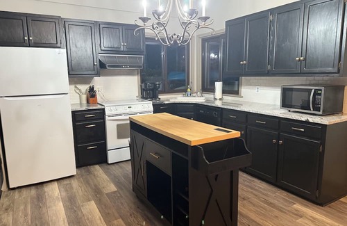 Commerce Township House | Lakeside 3 bedroom retreat with game room, hot tub and kayaks