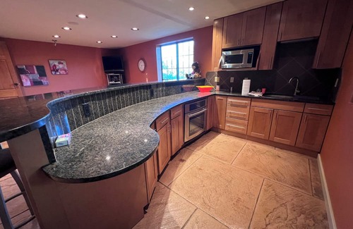 Pershing House | Family-Friendly Nebraska Estate with Scenic Pool, Gym, Theater & Fire Pit Fun