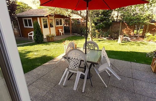 Booktown Apartment | Fully furnished garden suite one block from downtown, ocean in charming Sidney