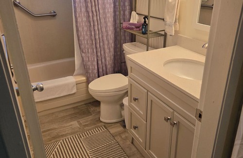 Booktown Apartment | Fully furnished garden suite one block from downtown, ocean in charming Sidney