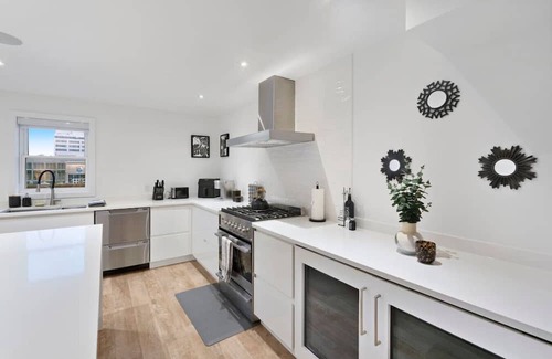 Downtown Apartment | Central and Lux 2BR Suite with Den and BBQ Sleeps 6