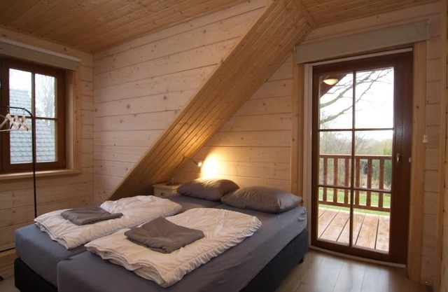 Albert wooden house in wooded area with beautiful views over the countryside