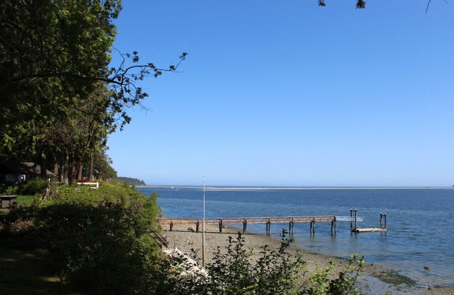 Surrounded by evergreens and overlooking Sequim Bay