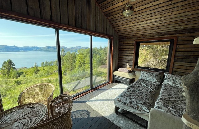 Stunning fiord panorama view off-grid forest cabin