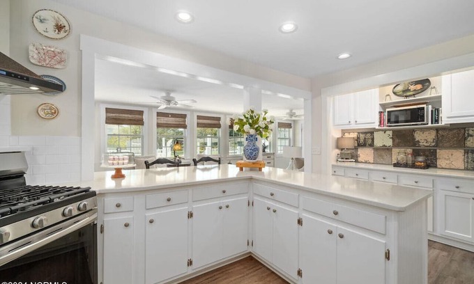 Cedar Point House | Luxury at the Water, enjoy the bikes, kayaks, volleyball, and shared dock that is a short walk away.