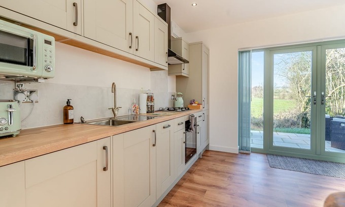 Coed-Y-Paen Cottage | Fox Acre is a stunning lodge with views over the rolling hills, perfect for a relaxing break away or