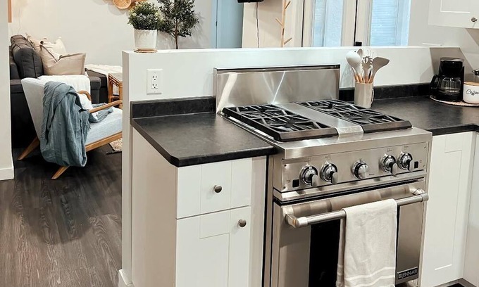 Kamloops House | Guest suite with cozy outdoor fire place and minutes from all local amenities