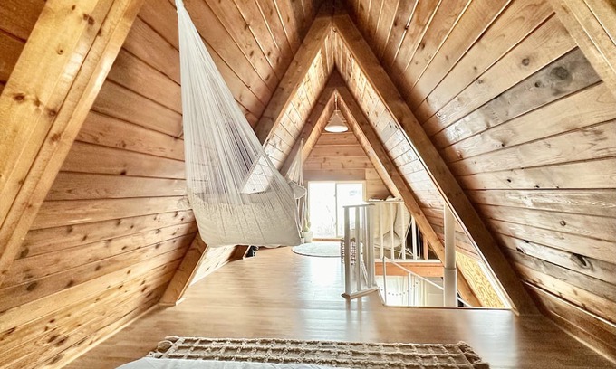 Division No. 10 Cabin | Techni Cabin offers a cozy A-frame blending rustic charm with modern comforts.