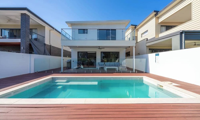 Helensvale House | Waterfront Wonder - Pool, Views & Luxury Stay