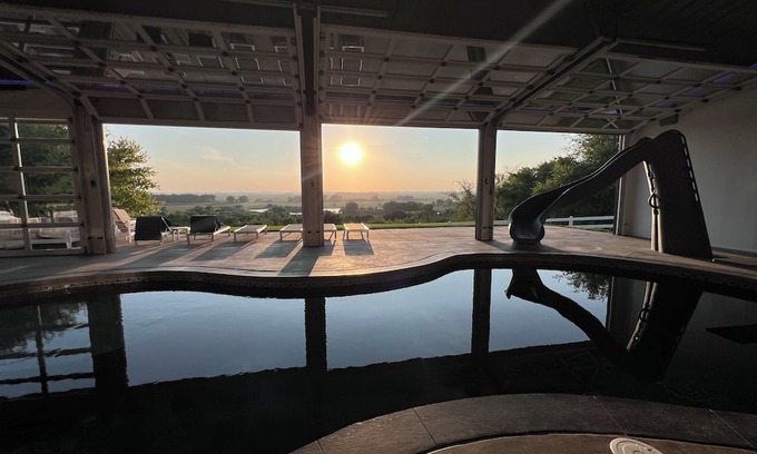 Pershing House | Family-Friendly Nebraska Estate with Scenic Pool, Gym, Theater & Fire Pit Fun