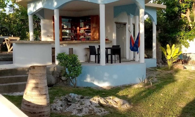 Little Bay Cottage | Fruit Tree Beach Cottage, Bar and Grill with private beach and beautiful sunsets